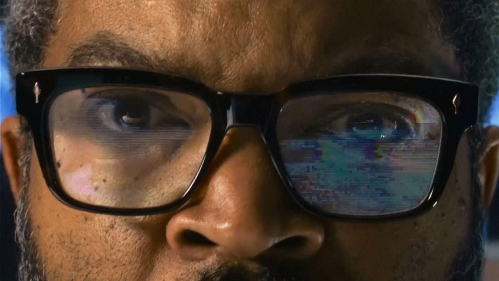 A close-up on Mr Cube's glasses.