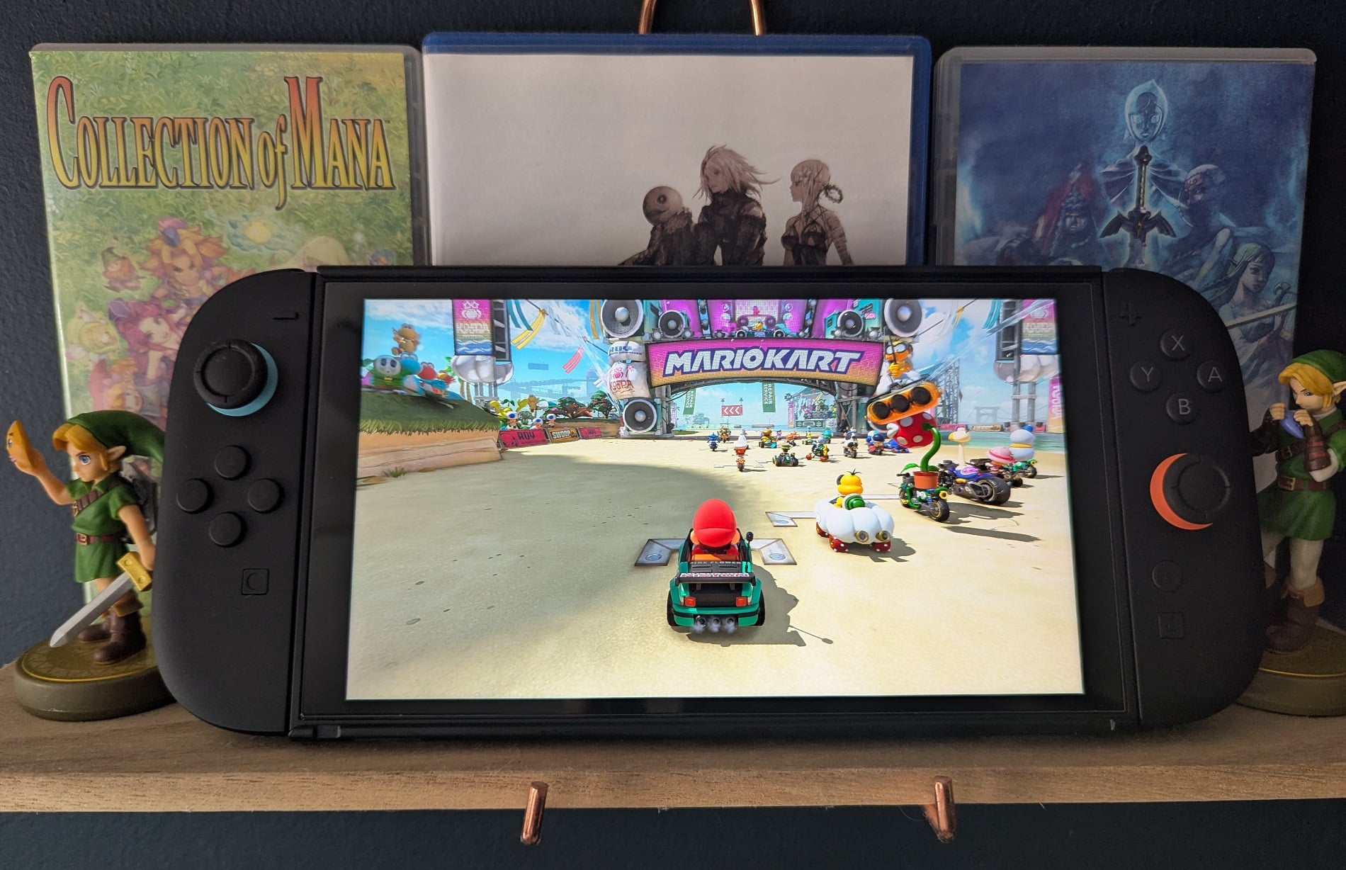 A Switch 2 sits on a shelf displaying a game. 